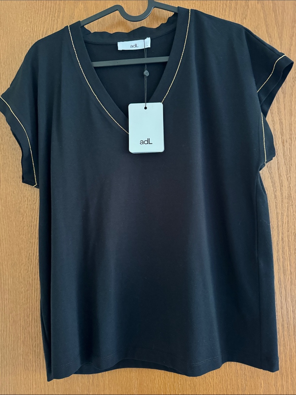 Women's Black V-Neck Short Sleeve Top with Gold Stitching
